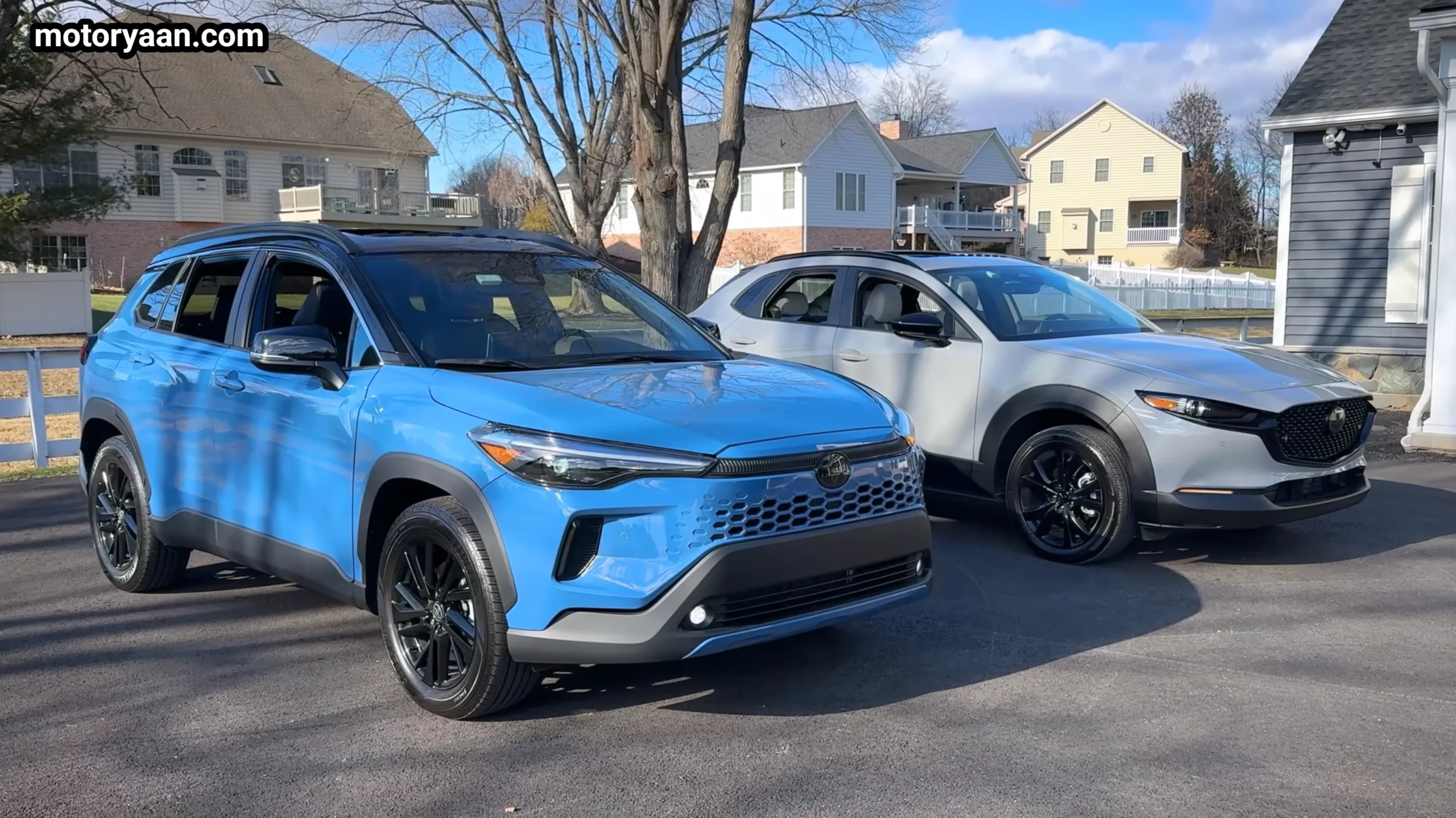 Toyota Corolla Cross Hybrid vs Mazda CX30 Turbo side and front three quarter profile parked comparison