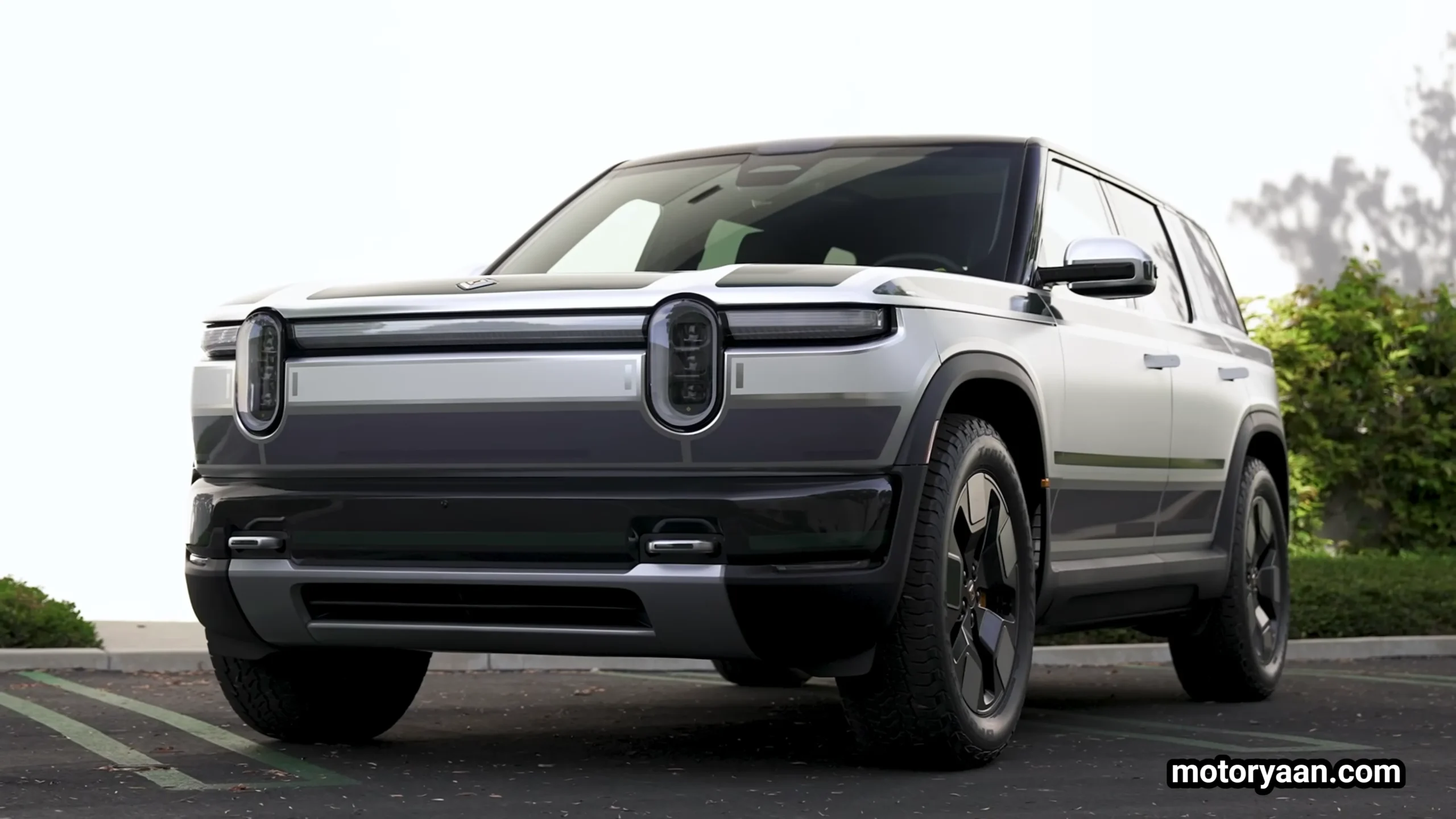 2026 Rivian R2 front and side profile showing boxy SUV design and oval LED headlights