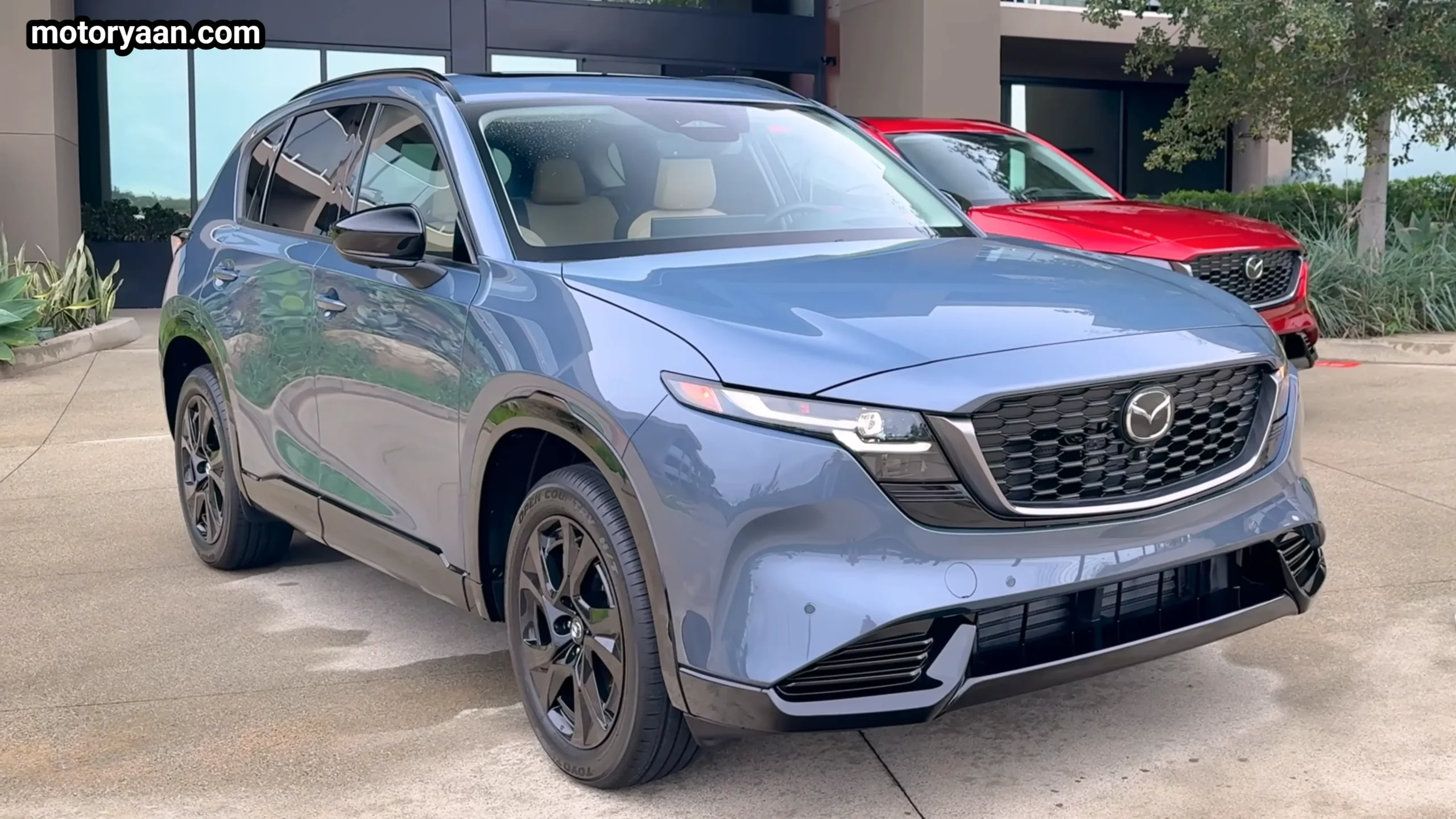 2026 Mazda CX 5 front three quarter profile showing grille and body lines