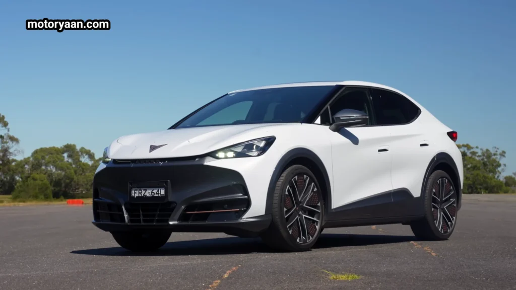 Cupra Tavascan VZ front three quarter view showing coupe SUV stance and aerodynamic body design