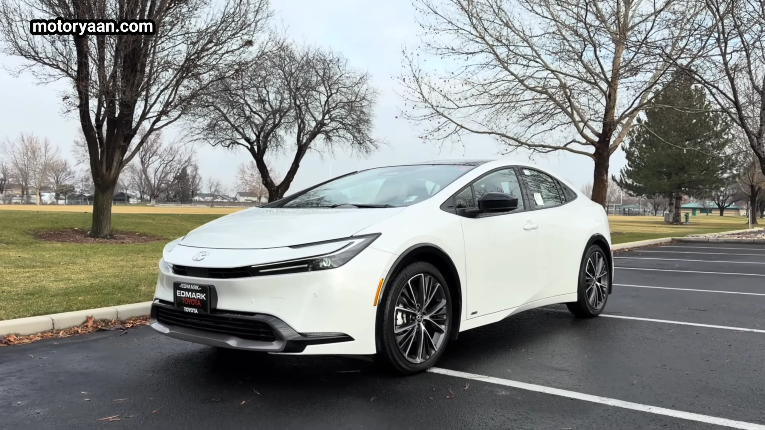 2026 Toyota Prius Limited AWD front and side profile in Wind Chill Pearl