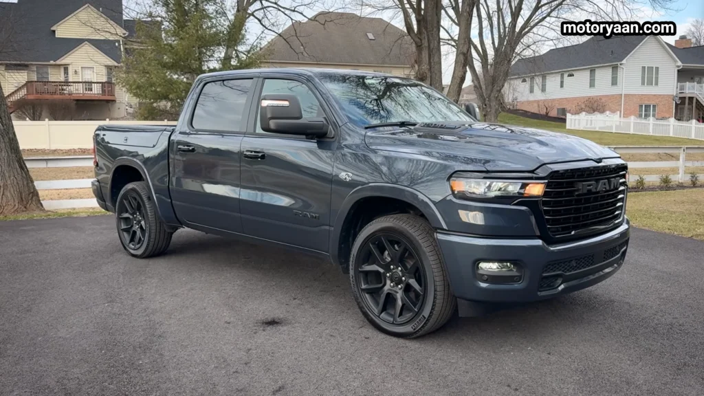 2026 Ram 1500 Laramie front and side profile showing bold grille, sculpted hood, and crew cab stance