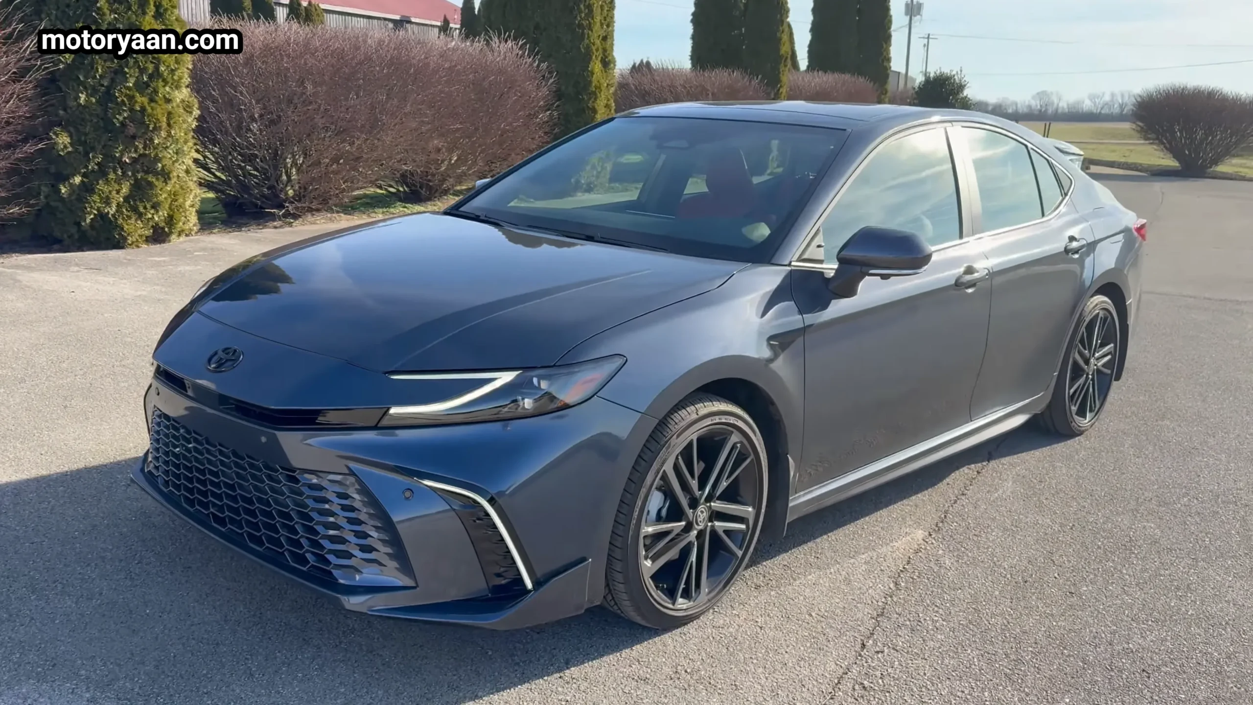 Front three quarter view of the 2026 Toyota Camry Hybrid silver sedan