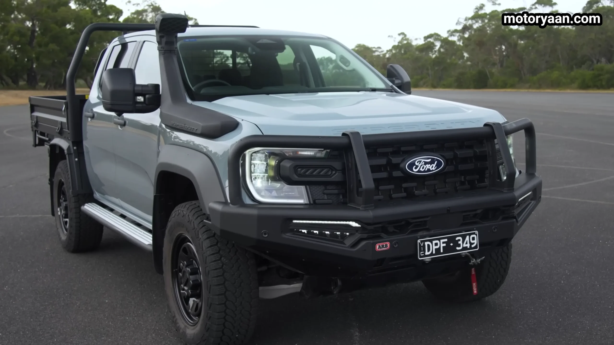 2026 Ford Ranger Super Duty front three quarter view showing rugged stance and wide track