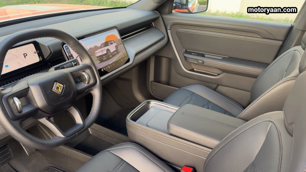 2026 Rivian R2 front interior dashboard steering wheel and front seats