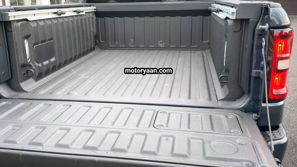 2026 Ram 1500 Laramie truck bed with tailgate open showing cargo space