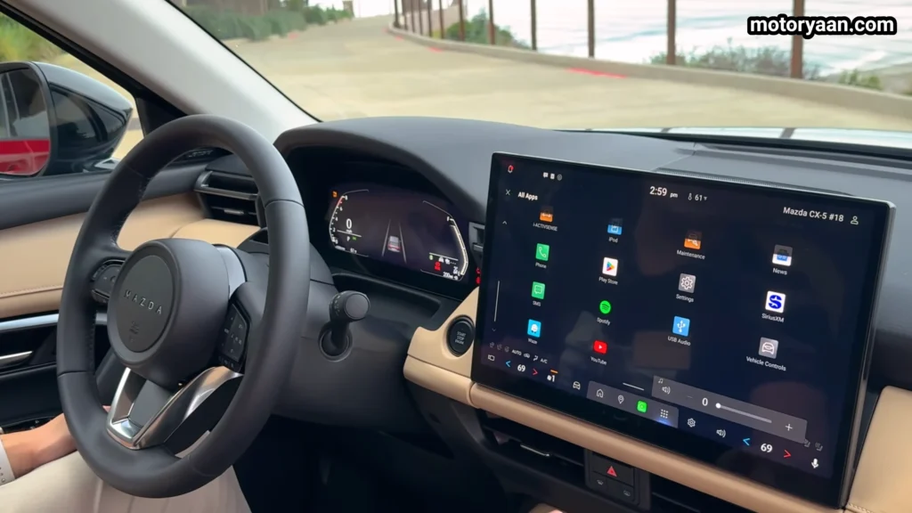 dashboard view of the 2026 Mazda CX 5 with steering wheel and large infotainment screen