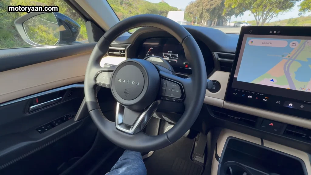 2026 Mazda CX 5 steering wheel with mounted controls