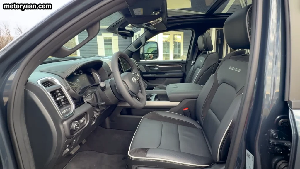 2026 Ram 1500 Laramie interior showing dashboard, steering wheel, center console, and front seats