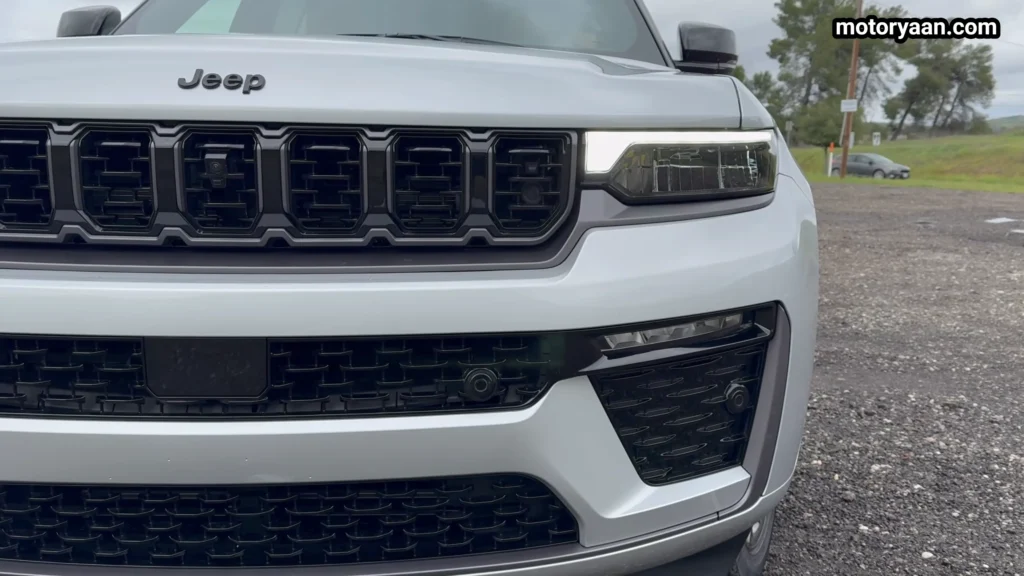 2026 Jeep Grand Cherokee L front fascia close up with revised grille and LED headlights