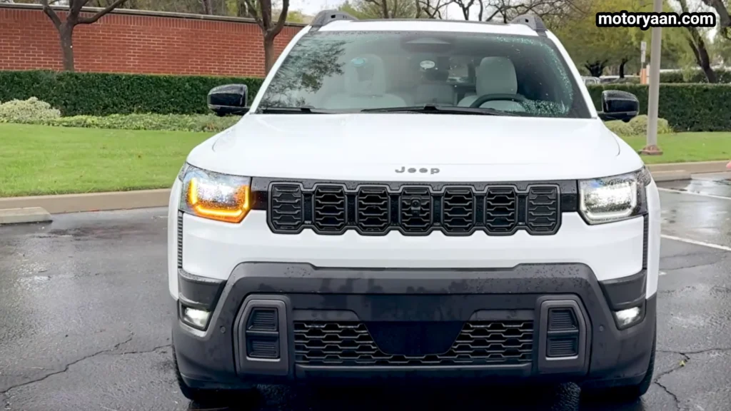 2026 Jeep Cherokee Hybrid front profile with LED headlights and seven slot grille