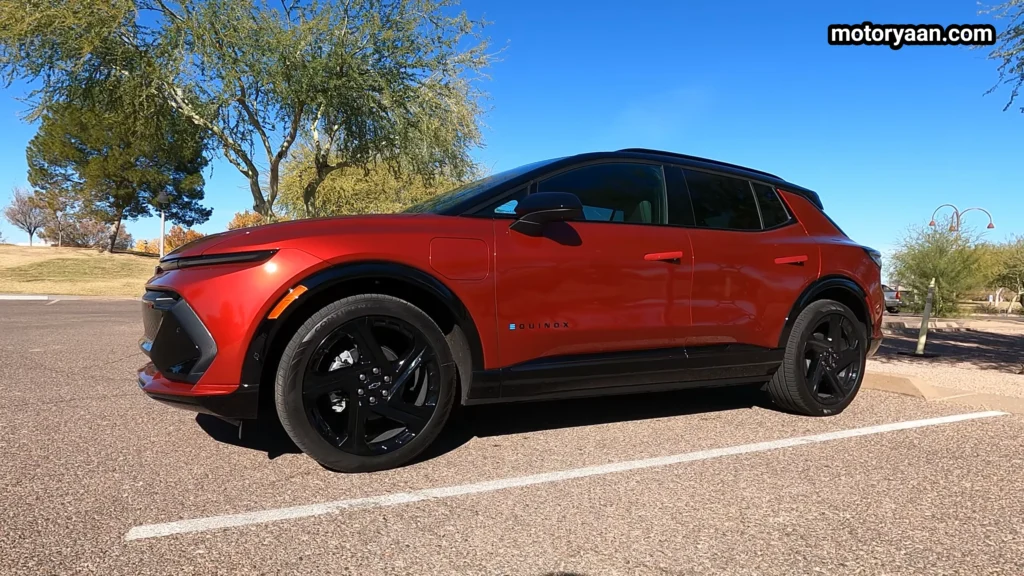 2026 Chevrolet Equinox EV RS side profile with two tone paint and roof rails
