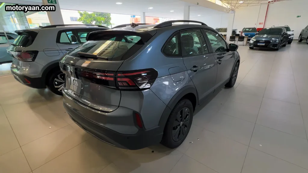 Volkswagen Nivus Sense 2026 rear three quarter view showing tail lamps and coupe roofline Mahindra XUV 7XO Facelift Review