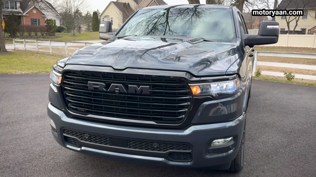 2026 Ram 1500 Laramie close up front fascia with grille and hood detailing