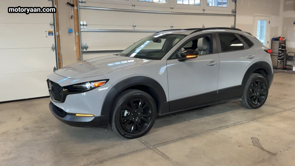 Side profile of the 2026 Mazda CX30 Air Edition with black cladding and alloy wheels