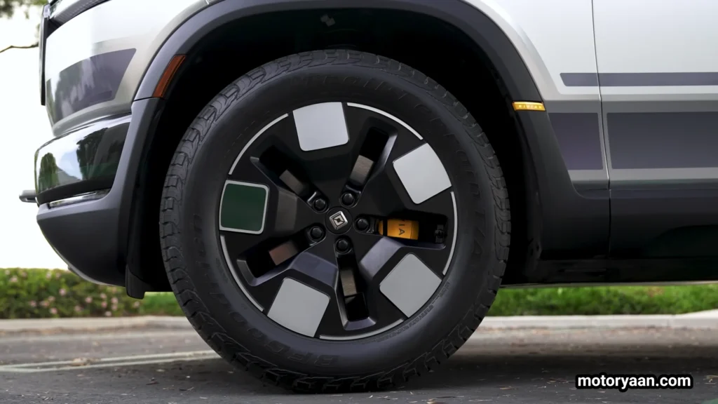 2026 Rivian R2 alloy wheel close up with rugged tire design