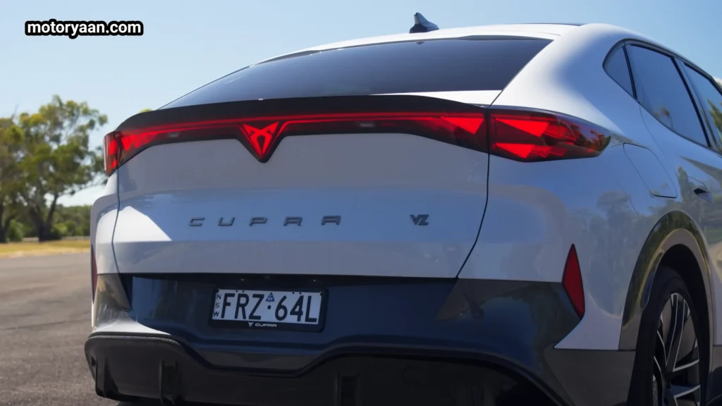 Cupra Tavascan VZ rear profile with full width LED light bar and sporty diffuser