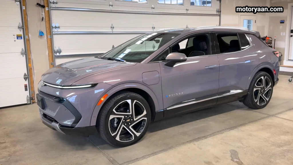 Complete side profile of the 2026 Chevrolet Equinox EV LT showing long wheelbase and roof rails