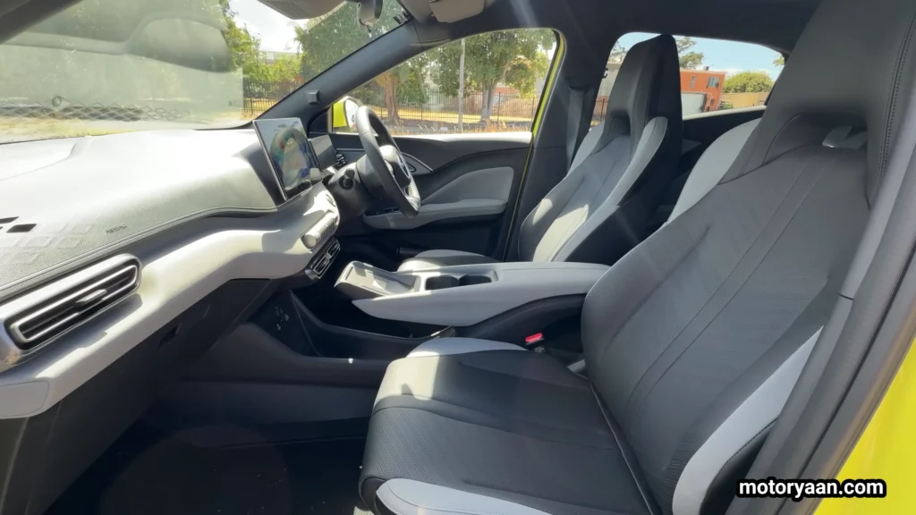 BYD1 Long Term Ownership front seats and center console with rotary controls, wireless charger, and compact cabin layout