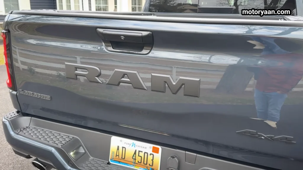 2026 Ram 1500 Laramie rear profile with tailgate and large Ram badging
