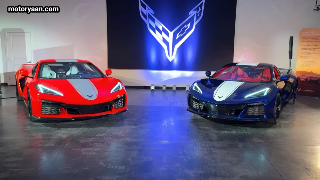 Front and side profile of 2027 Chevrolet Corvette Grand Sport in orange and blue showing widebody stance