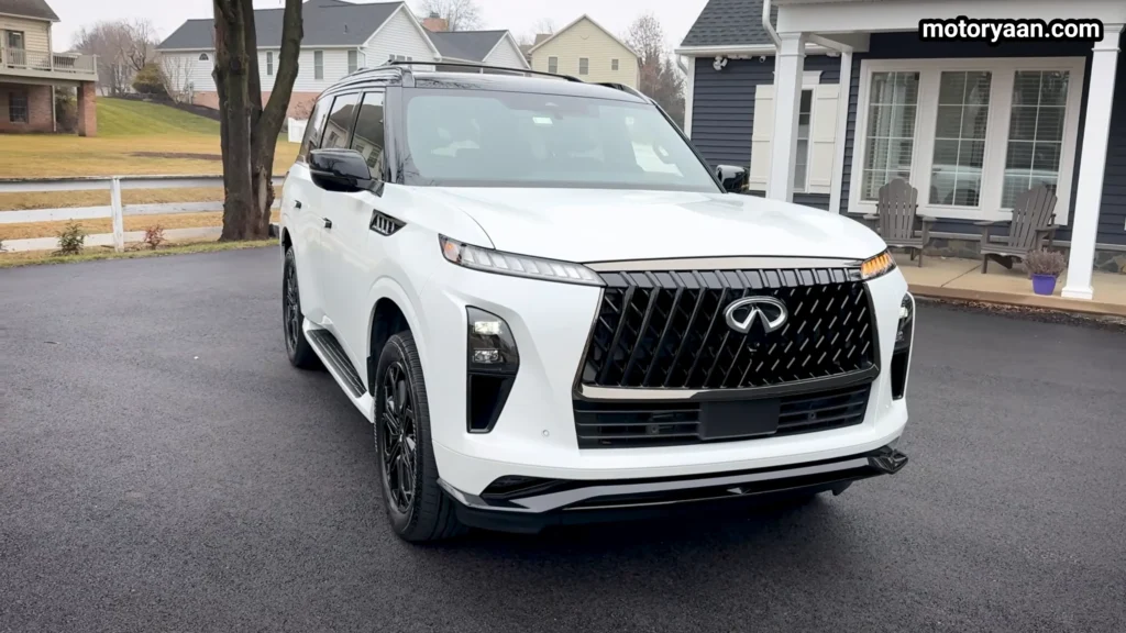 2026 Infiniti QX80 Sport front three quarter view with LED lighting and bold stance