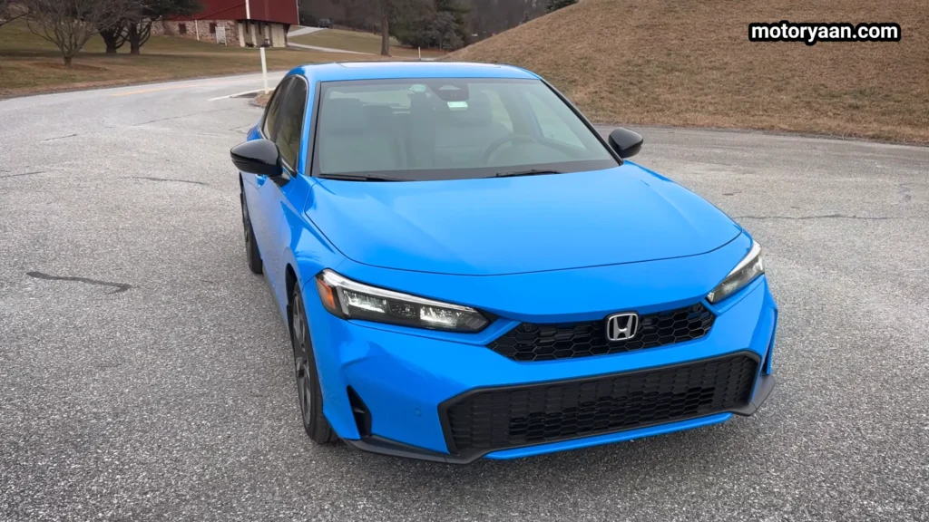 2026 Honda Civic Hybrid Hatchback front three quarter view with partial side profile