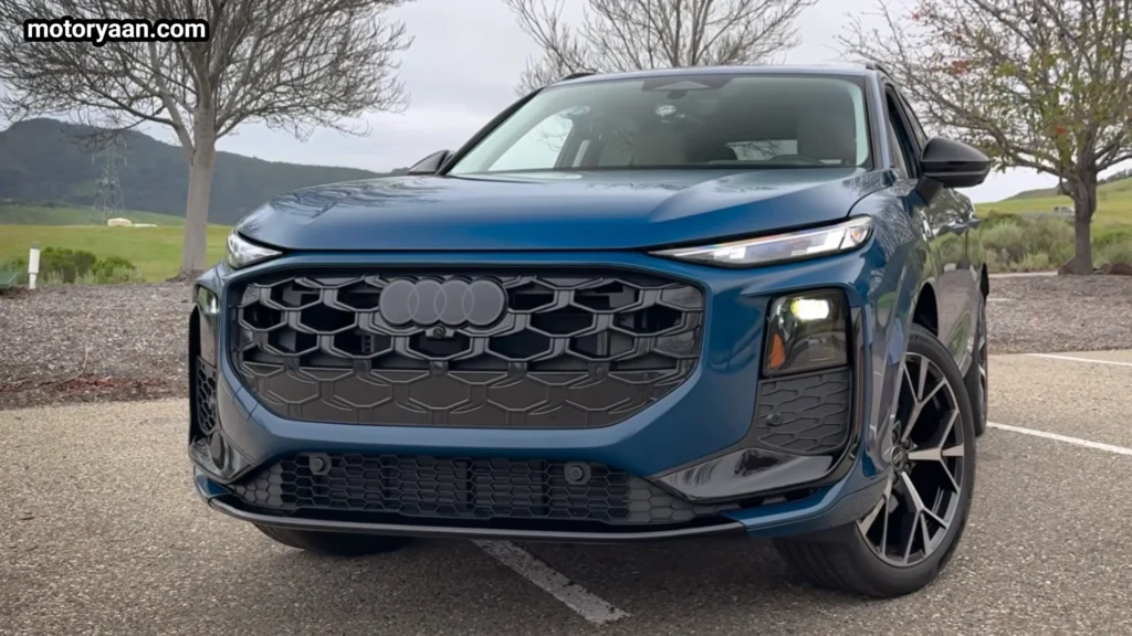 2026 Audi Q3 front three quarter view showing the signature Audi single frame grille and sporty side profile