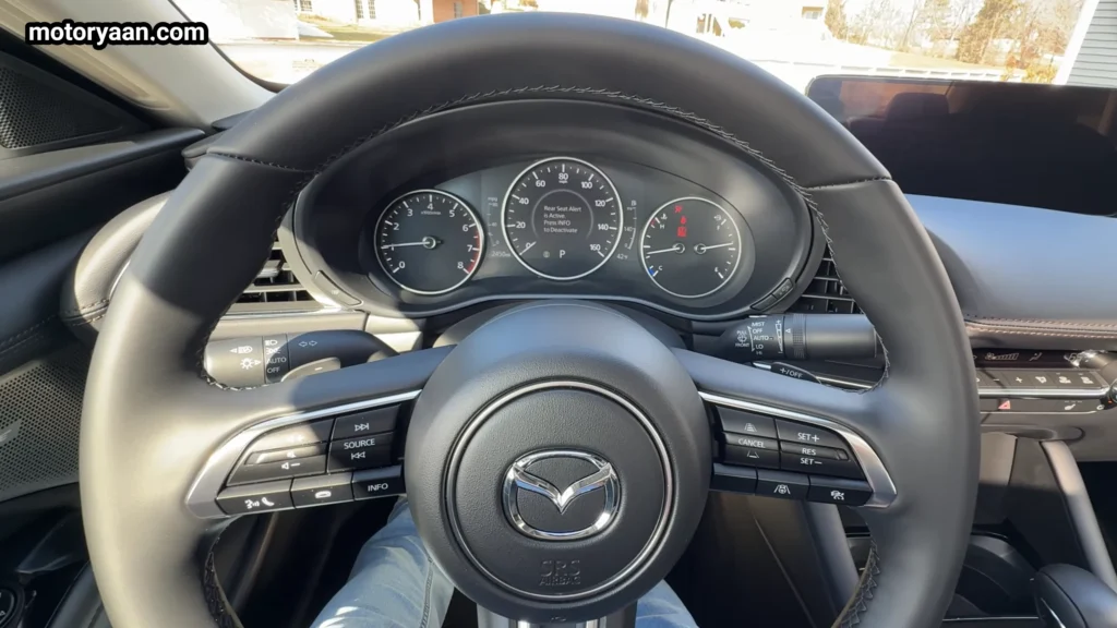 2026 Mazda 3 instrument cluster with analog and digital display layout