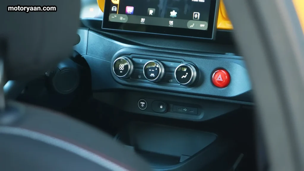 Renault Twingo EV climate control panel with physical knobs and buttons