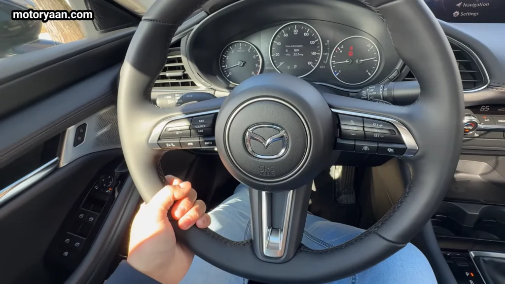 2026 Mazda 3 steering wheel with mounted controls and premium finish
