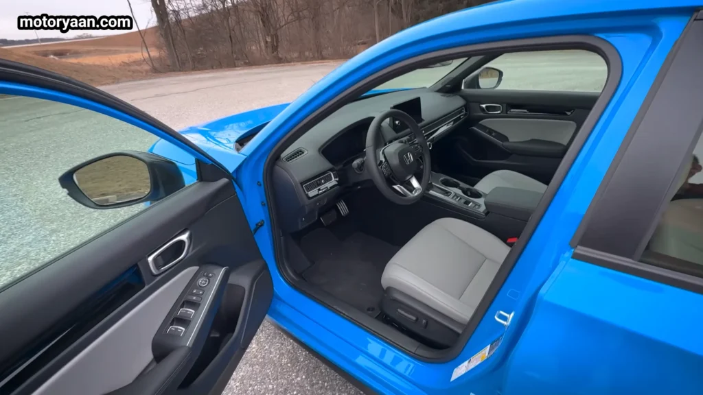 2026 Honda Civic Hybrid Hatchback front interior dashboard steering wheel view