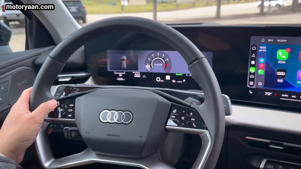 2026 Audi Q3 steering wheel with steering mounted controls and digital instrument cluster