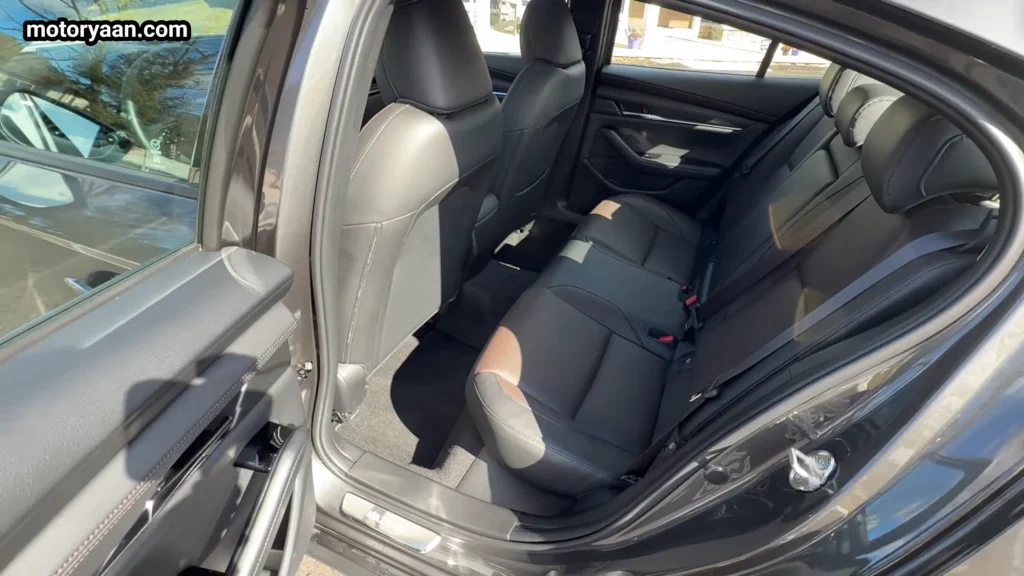 2026 Mazda 3 rear seat space with leather upholstery and compact legroom