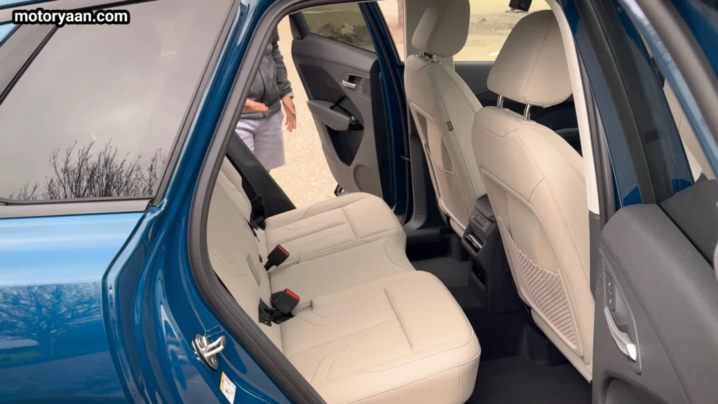 2026 Audi Q3 rear seats showing second row passenger space and foldable seat design