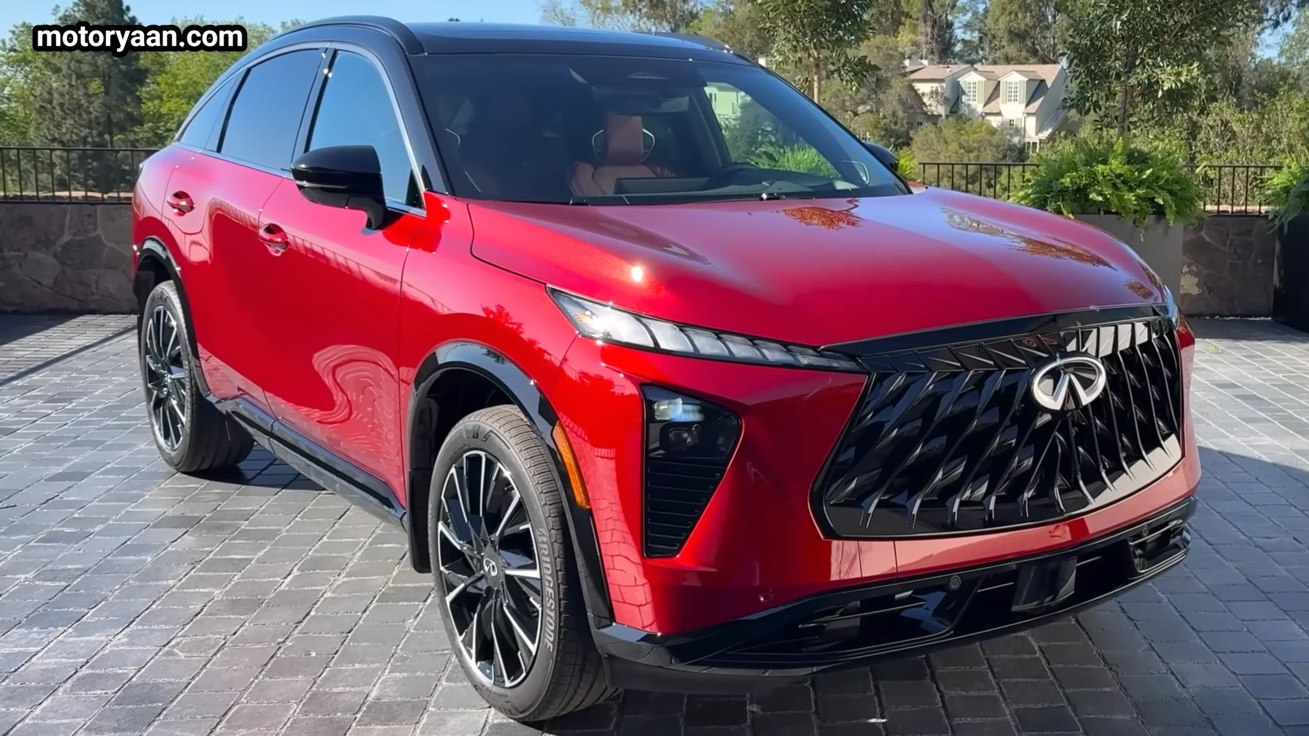 2027 Infiniti QX65 front three quarter view showing fastback roofline and sporty stance