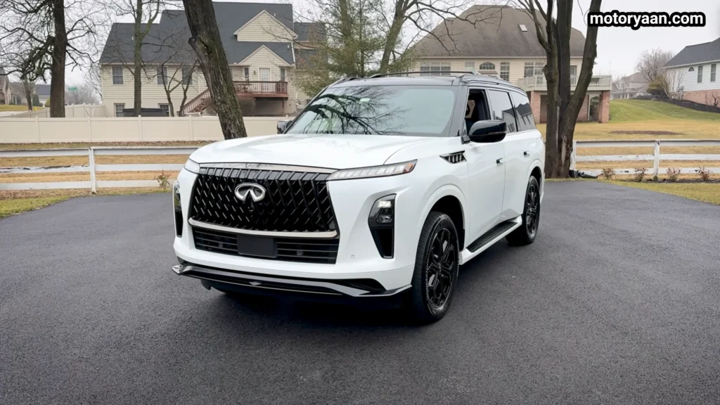 2026 Infiniti QX80 Sport angled front side profile with 22 inch wheels