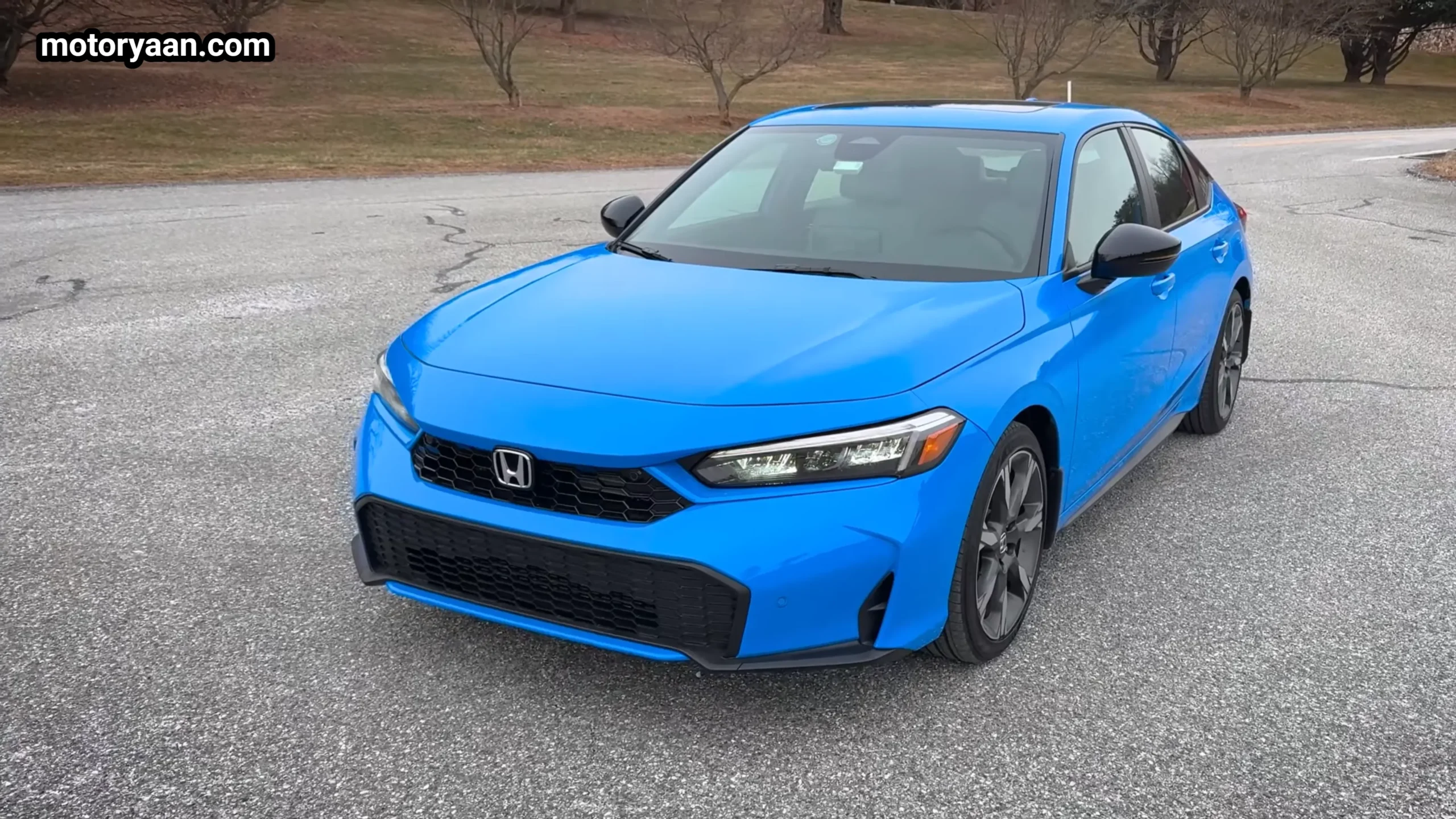 2026 Honda Civic Hybrid Hatchback front and side profile view showing sporty stance