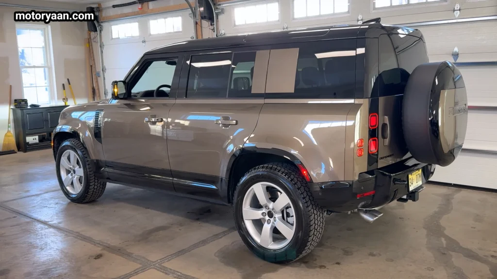 Defender 110 X Dynamic SE side and rear three quarter profile showing spare wheel mounted on tailgate