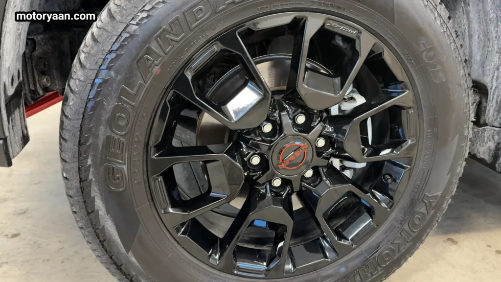 2026 Nissan Armada Pro 4X alloy wheel close up with off road tire
