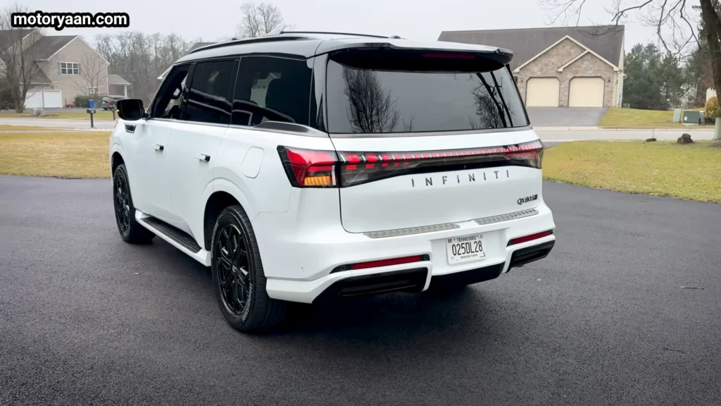 2026 Infiniti QX80 Sport rear three quarter view with LED tail lamps