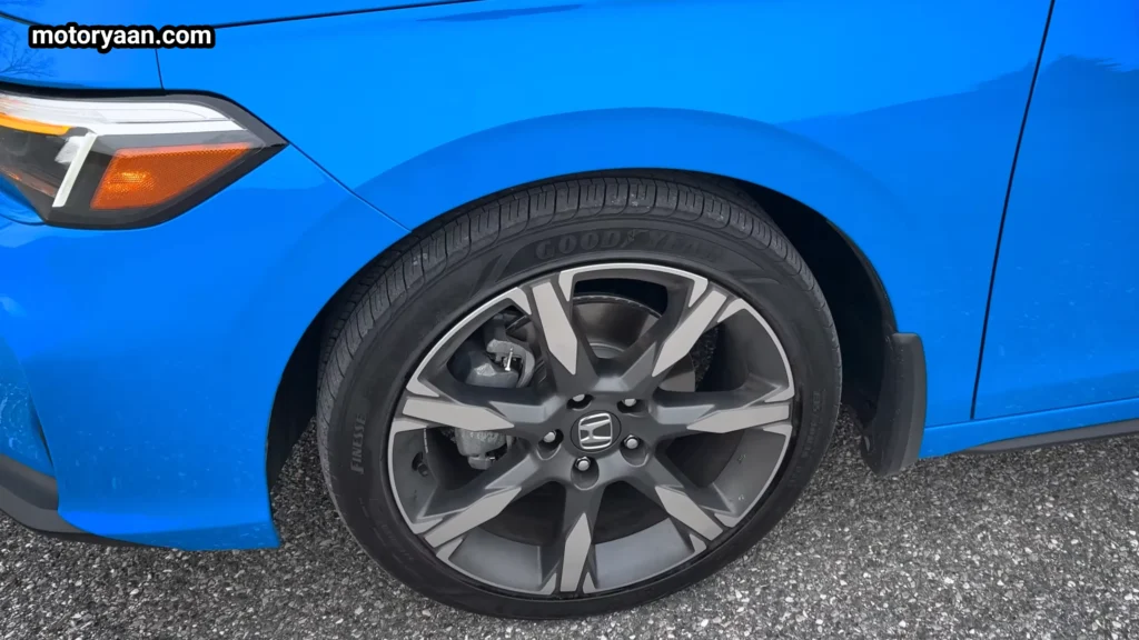 2026 Honda Civic Hybrid Hatchback alloy wheel close up with multi spoke design