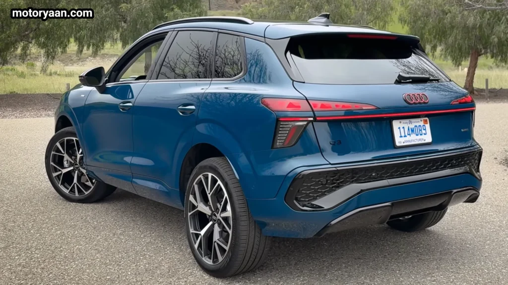 2026 Audi Q3 full side and rear profile with LED tail lights and rear spoiler