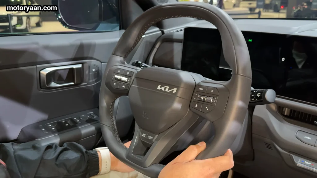 2027 Kia Seltos X Line steering wheel with mounted controls and flat bottom design