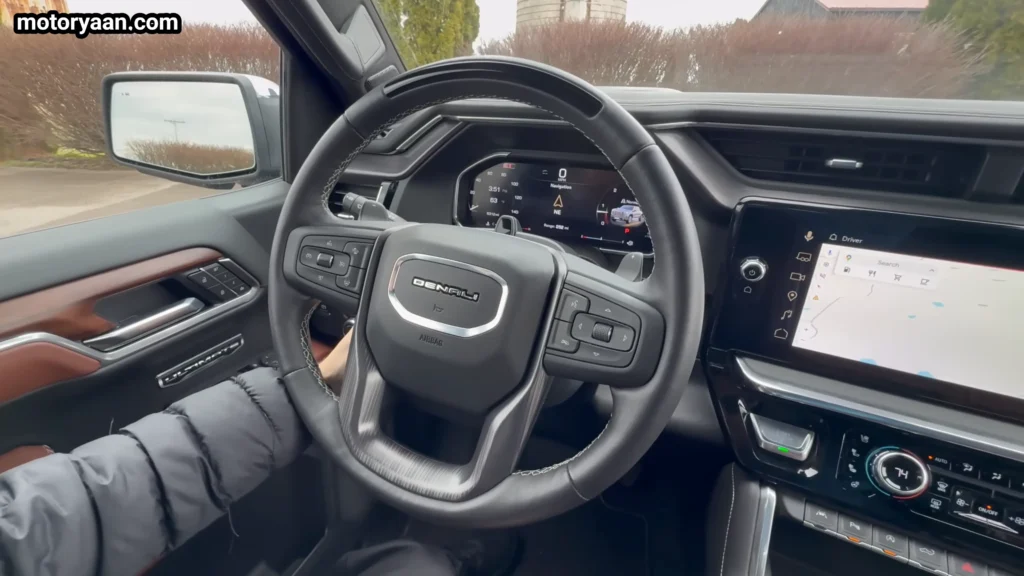 2026 GMC Sierra 1500 Denali Ultimate steering wheel with mounted controls and cruise buttons