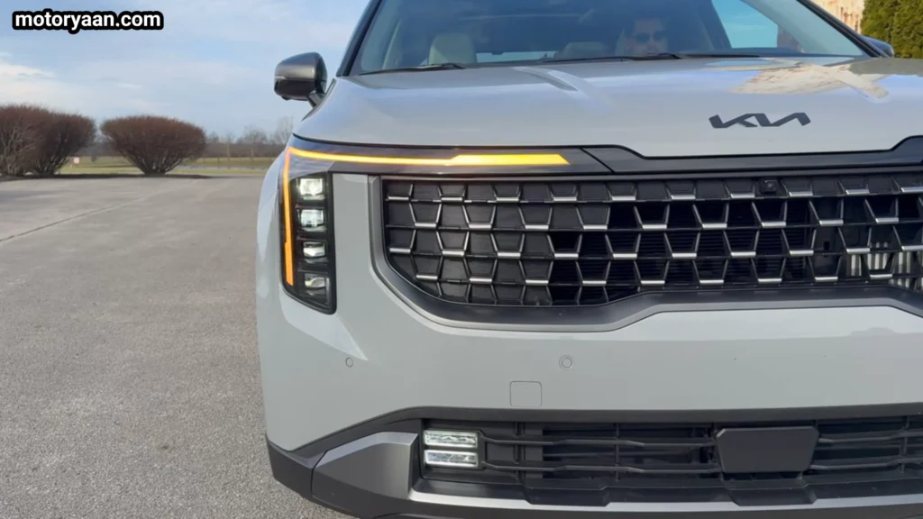 2026 Kia Carnival front profile close up showing LED headlamps and signature grille