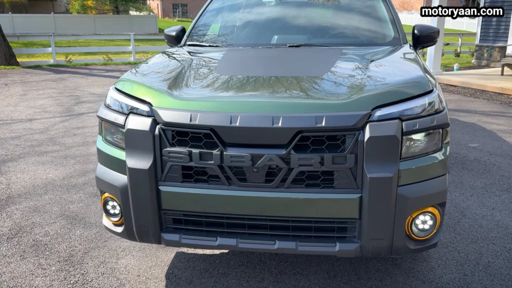 close up front fascia of 2026 Subaru Outback Wilderness grille and LED headlights