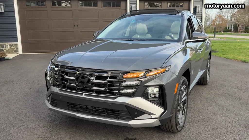 2026 Hyundai Tucson Hybrid front three quarter view showing grille and side lines