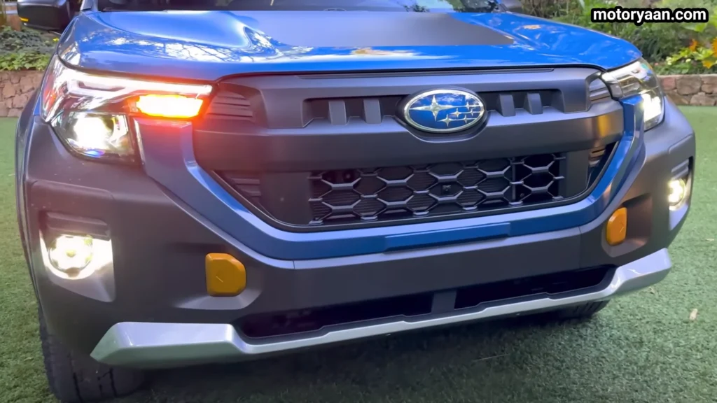 2027 Subaru Forester Wilderness Hybrid front close up showing grille, LED DRLs and fog lights