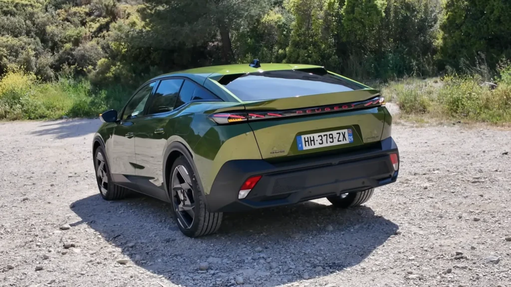 2026 Peugeot 408 Facelift rear three quarter view with LED tail lamps and sloping roofline
